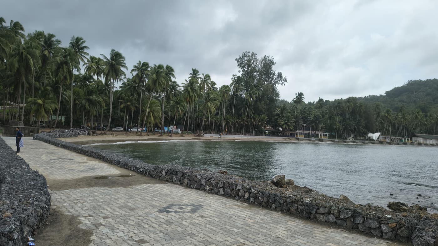 Overcast monsoon sky over the calm bay at Corbyn's Cove, Port Blair